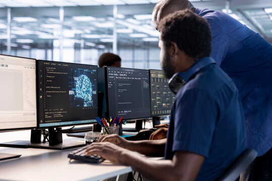 Team of server farm coworkers using AI systems to input data faster during complex computational tasks. Teamworking data center colleagues using artificial intelligence parallel processing tech