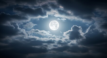Full moon illuminating night sky with dramatic clouds and atmosphere