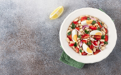 Traditional Turkish Piyaz white bean salad. Turkish cuisine. Protein salad. Top view. Copy space.