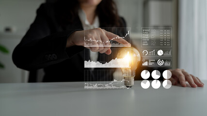 A professional woman engages with digital data visualization elements in a modern office. The scene showcases charts and a light bulb, symbolizing innovation and strategy. Impute