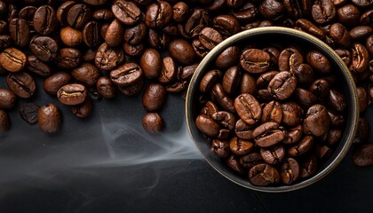 Naklejka premium A dark, high-angle shot of roasted beans spilling around a ceramic bowl, with wisps of steam rising from below