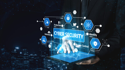 A business professional in a suit interacts with a tablet displaying cyber security concepts, symbolizing modern solutions for digital protection and identity management. Tessel