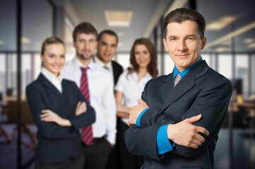 Confident  serious business man at meeting