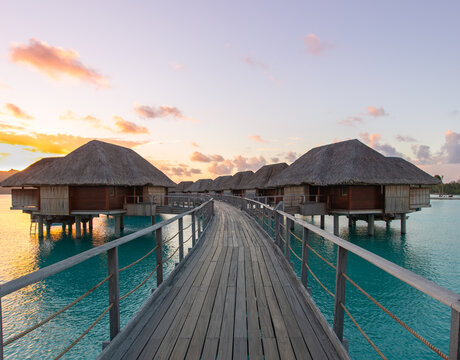 Overwater bungalows Bora Bora turquoise water sunset