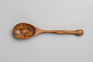 Wooden cooking spoon on white surface high resolution picture