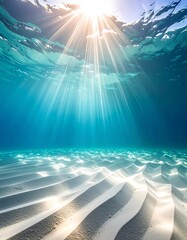 Sunlight streams through the turquoise water onto white sand ripples