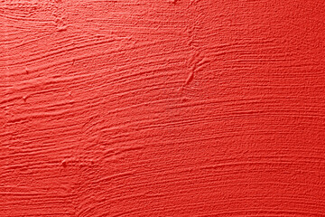 Background of natural red pink stucco in plaster cement texture lined pattern or stone in colors  Textured illuminated wall fence surface blend of tones backdrop.