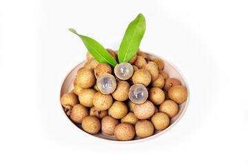 High angle view of Fresh longan fruit in white plate. Isolated on white background with copy space....