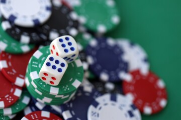 Dice game on the poker table in the casino. A successful combination of dice brought a lot of winning chips