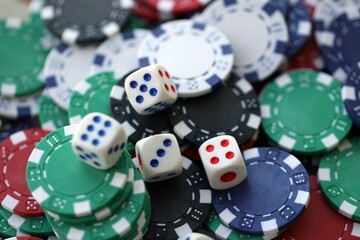 Dice game on the poker table in the casino. A successful combination of dice brought a lot of winning chips