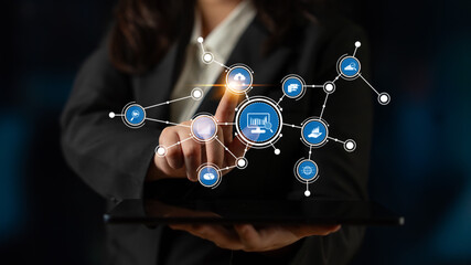 A businesswoman uses a digital tablet to explore innovative network connections and technology icons, highlighting the importance of data visualization in today business landscape. Tessel