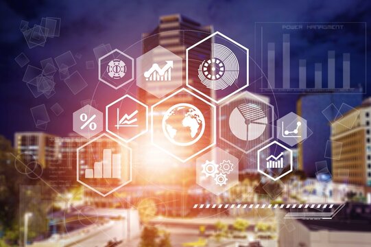 Digital financial charts and skyline at night,