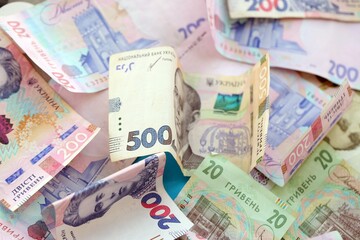 Big amount of different Ukrainian hryvnia money bills. Pile of crumpled ukrainian banknotes