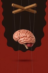 Brain puppet suspended by strings, symbolizing control and manipulation of the mind