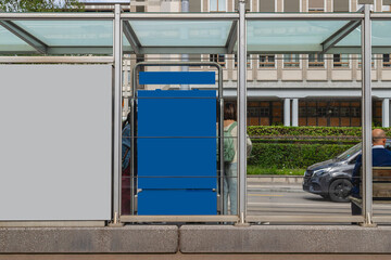 Mockup of blue blank billboard at modern glass bus shelter with people waiting and city street view.