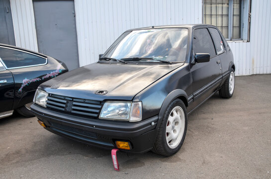 Black Peugeot 205 supermini produced by the French automaker  widely credited with turning around Peugeot's fortunes in the 1980s and is considered an icon of its era