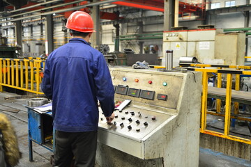 Workers on the production line of the strip steel coil factory are working