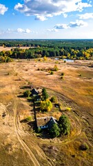 High-angle view of autumnal landscape with rural homes