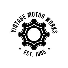 Fototapeta premium Black and white logo featuring a gear with the words 'Vintage Motor Works' and 'Est. 1965'.
