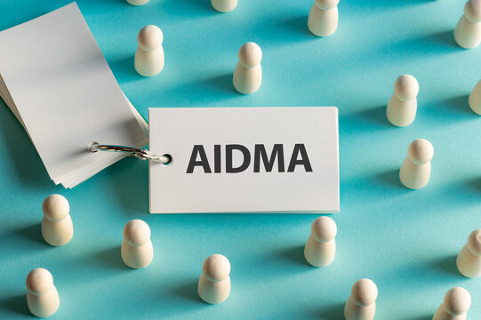 There is word card with the word AIDMA. It is an abbreviation for Attention, Interest, Desire, Memory, Action as eye-catching image.