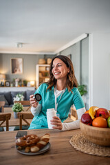 Woman nurse having healthy break in kitchen