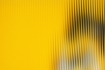 Abstract yellow background with vertical lines and reflections
