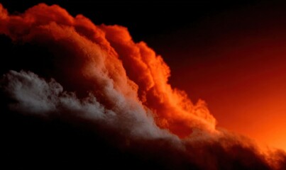 Volcanic eruption producing a fiery red and orange ash cloud against a dark sky, highlighting the powerful forces of nature
