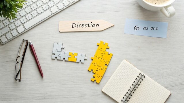 Direction and Teamwork: Puzzle Pieces on a Desk