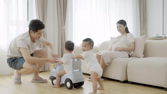 Parents watching their twin babies play with a baby vehicle