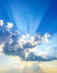 Stunning sky, sunbeams through clouds