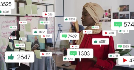 Planner adjusting notes on clear board as floating media icons mapping marketing engagement climb - Powered by Adobe