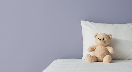 A cute brown stuffed bear sitting on a bed against a purple wall. Plush toy in a child's bedroom. Minimalist childhood concept with copy space