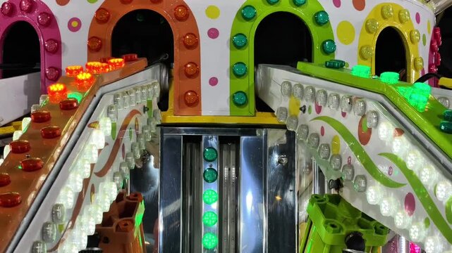 Experience the thrill of a nighttime amusement park, where vibrant lights illuminate rides. This video captures the joy and energy of thrilling roller coasters and colorful carnival attractions