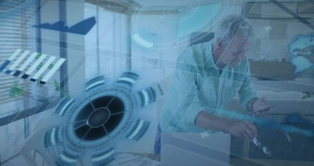 Senior man picking smartphone to ear and activating holographic charts on laptop for tech analysis - Powered by Adobe