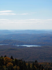 Panoramic view from Mont-Tremblant summit with lakes and autumn forest
