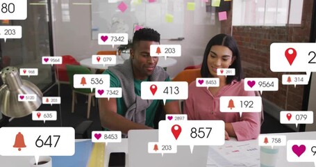 Coworkers tracking social media metrics on laptop updating fast with heart icons to measure growth - Powered by Adobe