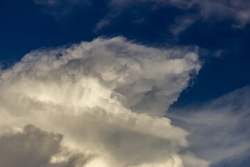 Clouds in the blue sky before a thunderstorm. Toned.