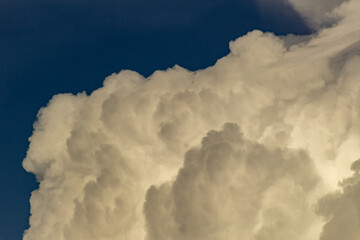 Clouds in the blue sky before a thunderstorm. Toned.
