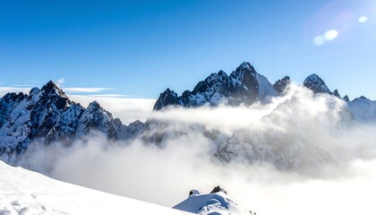 Snowy mountain peaks rising above a sea of clouds