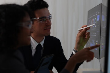 Diverse Team Working Together in Modern Co-Working Space. Casual meeting of senior diverse business team analyzing financial data. Multiethnic business people working in the office. senior man.