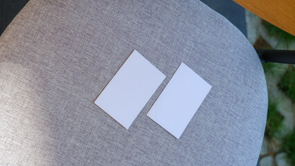 plain business card on the fabric sofa background