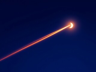 Dramatic surreal photo of a half moon with glowing orange airplane contrail crossing the night sky