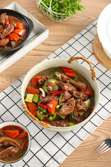 Braised Goose Stew with Vegetables in Ceramic Bowl on Rustic Wooden Table