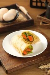 Healthy Vegetable Wraps with Carrots and Greens on Rustic Wooden Table with Fresh Eggs