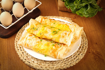 Ham and Egg Dumplings Breakfast with Fresh Ingredients on Wooden Table