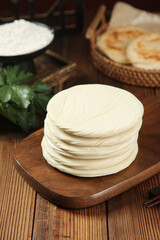 Traditional Chinese Flatbread Wraps on Wooden Board - Asian Cooking Ingredients