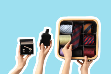 Hands holding men's neckties and accessories on blue background