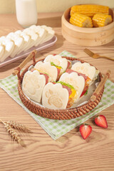 Adorable Bear Paw Sandwiches in Basket - Kids Lunch with Milk and Corn on Wooden Table