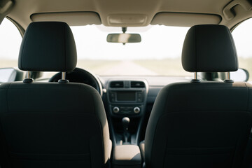 Modern automobile interior with comfortable seats, focused on clean dashboard and minimalistic design for everyday driving