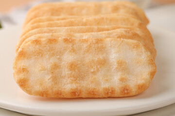 Crispy Golden Rice Cakes on White Plate - Healthy Snack Food